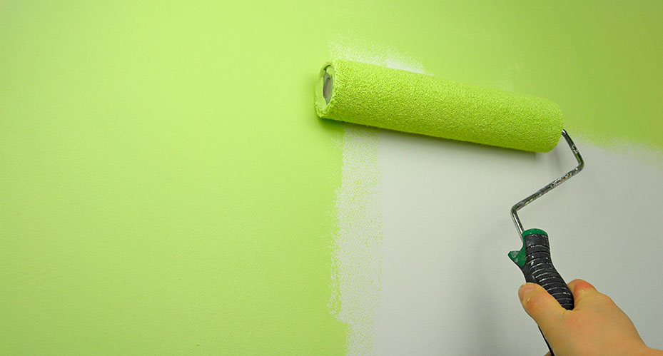photo of a paintbrush painting a wall, modernizing the look of a space, similar to redesigning and modernizing a website for 2019