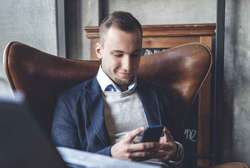 photo of a business owner reading a website design blog for information on how he should approach a web design project