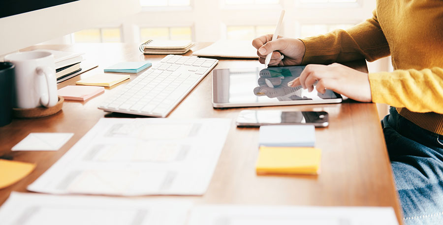 photo of a web designer sketching a mockup of a web site design for an Edmonton client